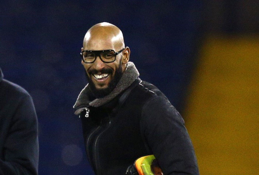 Nicolas Anelka in a coat